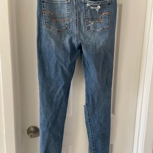 American Eagle NE(X)T LEVEL STRETCH‎ light washes ripped jeans. Size 4 long